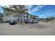 View of the exterior of the condo building with on-site parking for residents and guests at 4802 51St W St # 1118, Bradenton, FL 34210