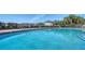 A large community swimming pool with plenty of lounge chairs, perfect for relaxation at 4802 51St W St # 1118, Bradenton, FL 34210