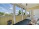 Cozy screened-in porch features neutral tones and relaxing seating with views of the community at 4802 51St W St # 1118, Bradenton, FL 34210
