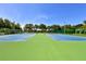 A community tennis court with green and blue courts at 4802 51St W St # 1118, Bradenton, FL 34210