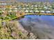 Aerial view showcasing home's location by the lake at 4914 Lakescene Pl, Sarasota, FL 34243