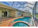 Enclosed pool and spa with lake view at 4914 Lakescene Pl, Sarasota, FL 34243