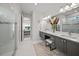 Elegant bathroom with double vanity, large mirror, and walk-in shower at 4947 Surfside Cir, Bradenton, FL 34211
