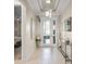 Bright and airy foyer with tile floors and elegant decor at 4947 Surfside Cir, Bradenton, FL 34211