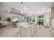 Open concept kitchen with island, stainless steel appliances, and views to living area at 4947 Surfside Cir, Bradenton, FL 34211