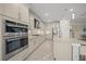 Modern kitchen with stainless steel appliances and light-colored cabinetry at 4947 Surfside Cir, Bradenton, FL 34211