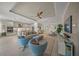 Open concept living room with comfortable seating and a view of the kitchen at 4947 Surfside Cir, Bradenton, FL 34211