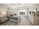Main bedroom with a king-size bed, large windows, and an ensuite bathroom at 4947 Surfside Cir, Bradenton, FL 34211