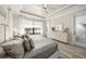 Main bedroom with king-size bed, water view, and ample closet space at 4947 Surfside Cir, Bradenton, FL 34211