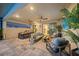 Outdoor patio with seating area and view of pool and kitchen at 4947 Surfside Cir, Bradenton, FL 34211