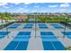 Expansive community pickleball courts with modern lighting at 4947 Surfside Cir, Bradenton, FL 34211