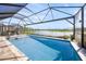 Luxury screened pool with spacious patio and lake view at 4947 Surfside Cir, Bradenton, FL 34211