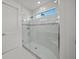 Large walk-in shower with glass enclosure and built-in seat at 4947 Surfside Cir, Bradenton, FL 34211