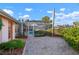 Beautiful backyard with brick pavers, lush landscaping and a screened in pool enclosure at 5207 Bimini Dr, Bradenton, FL 34210