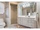 Bathroom featuring a glass door shower, a white vanity, and neutral wall colors at 5207 Bimini Dr, Bradenton, FL 34210