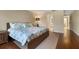 Bedroom featuring a bed with floral linens, hardwood floors, and natural light at 5207 Bimini Dr, Bradenton, FL 34210