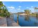 Scenic view down a canal lined with waterfront homes with boat docks and boat lifts at 5207 Bimini Dr, Bradenton, FL 34210