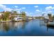 Picturesque waterfront homes featuring boat docks with boat lifts and scenic canal views at 5207 Bimini Dr, Bradenton, FL 34210