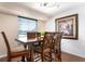 Bright dining area with a dark wood table and chairs, and a large window with a view at 5207 Bimini Dr, Bradenton, FL 34210