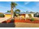 Lovely one-story home featuring a new metal roof, mature landscaping, and a well-manicured yard at 5207 Bimini Dr, Bradenton, FL 34210