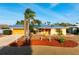 Charming single-story home with mature palms, xeriscaping and an attached two car garage at 5207 Bimini Dr, Bradenton, FL 34210