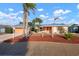 Charming single-story home with mature palms, xeriscaping and an attached two car garage at 5207 Bimini Dr, Bradenton, FL 34210