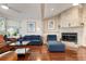 Living room featuring hardwood floors, a stone fireplace, and a comfortable seating area at 5207 Bimini Dr, Bradenton, FL 34210
