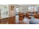 Living room featuring hardwood floors, leather seating, and a view of the pool at 5207 Bimini Dr, Bradenton, FL 34210