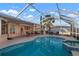 Relax and enjoy the screened-in pool and spa on the lanai, a perfect spot for outdoor entertainment at 5207 Bimini Dr, Bradenton, FL 34210