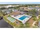 Aerial view of community pool, shuffleboard, and surrounding buildings at 5400 34Th W St # D12, Bradenton, FL 34210