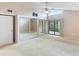 Main bedroom with mirrored closet doors and access to the patio at 5400 34Th W St # D12, Bradenton, FL 34210