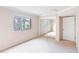 Bedroom with mirrored closet and window at 5400 34Th W St # D12, Bradenton, FL 34210