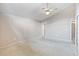 Spacious carpeted bedroom with ceiling fan at 5400 34Th W St # D12, Bradenton, FL 34210
