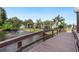 Wooden footbridge over a serene canal, offering scenic views at 5400 34Th W St # D12, Bradenton, FL 34210