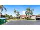 Exterior view of condo building with parking and landscaping at 5400 34Th W St # D12, Bradenton, FL 34210