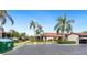 Exterior view of condo building with parking and landscaping at 5400 34Th W St # D12, Bradenton, FL 34210