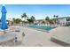 Community pool with plenty of lounge chairs at 5400 34Th W St # D12, Bradenton, FL 34210