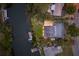 Bird's-eye view of the house, dock, and surrounding canals at 543 Hillcrest Dr, Bradenton, FL 34209