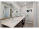 Modern bathroom with double vanity, white subway tile, and a glass shower at 543 Hillcrest Dr, Bradenton, FL 34209