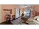 Charming bedroom with a floral bedspread and access to a patio at 543 Hillcrest Dr, Bradenton, FL 34209