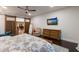 Main bedroom with sliding barn doors, featuring a dresser and comfortable seating at 543 Hillcrest Dr, Bradenton, FL 34209