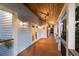 Covered porch with wood flooring and ceiling fan at 543 Hillcrest Dr, Bradenton, FL 34209