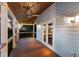 Covered porch with wood flooring and ceiling fan at 543 Hillcrest Dr, Bradenton, FL 34209