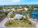 Bird's eye view of a single-story house on a canal at 5560 Shadow Lawn Dr, Sarasota, FL 34242
