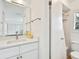 Bathroom with white vanity, single sink, and a shower/tub combination at 5560 Shadow Lawn Dr, Sarasota, FL 34242