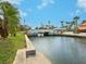 Peaceful canal view with a bridge in the distance at 5560 Shadow Lawn Dr, Sarasota, FL 34242