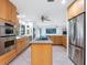 Eat-in kitchen with stainless steel appliances and an island at 5560 Shadow Lawn Dr, Sarasota, FL 34242