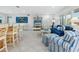 Open living and kitchen area with blue and white decor and a view of the pool at 5560 Shadow Lawn Dr, Sarasota, FL 34242