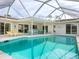Relaxing pool and patio area with a covered lanai at 5560 Shadow Lawn Dr, Sarasota, FL 34242