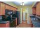 Kitchen with black appliances and wood cabinets at 5606 20Th S Ave, Gulfport, FL 33707